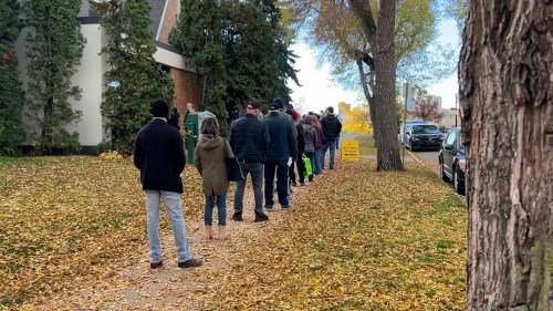 Voters at a downtown Edmonton polling station are pictured on Tuesday, Oct. 13, 2016. People were waiting for up to an hour to cast their ballots as the advanced polls for the Alberta referendum opened today.
THE CANADIAN PRESS/Jack Farrell