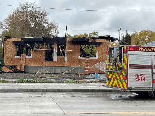 A house under construction on Archibald Street was severely damaged by fire Tuesday. (Matthew Frank / Free Press)